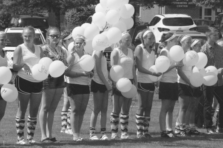 Members of the Mt. Ararat High School field hockey team prepare to release balloons last year as part of a fundraiser to support the Maine Children’s Cancer Program. The balloon release has been canceled this year over environmental concerns.