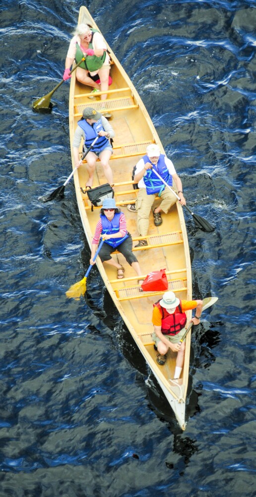 AUGUSTA, ME - AUGUST 10: Paddlers head south near the Cushnoc Crossing bridge during NRCM trip on Saturday August 10, 2019 on the Kennebec River in Augusta. (Staff photo by Joe Phelan/Staff Photographer)