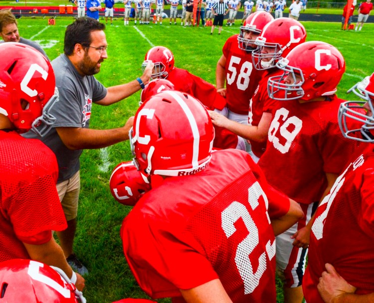 Cony football coach B.L. Lippert calls an offensive play during a scrimmage against Lawrence on Aug. 24, 2019 at Alumni Field in Augusta. 