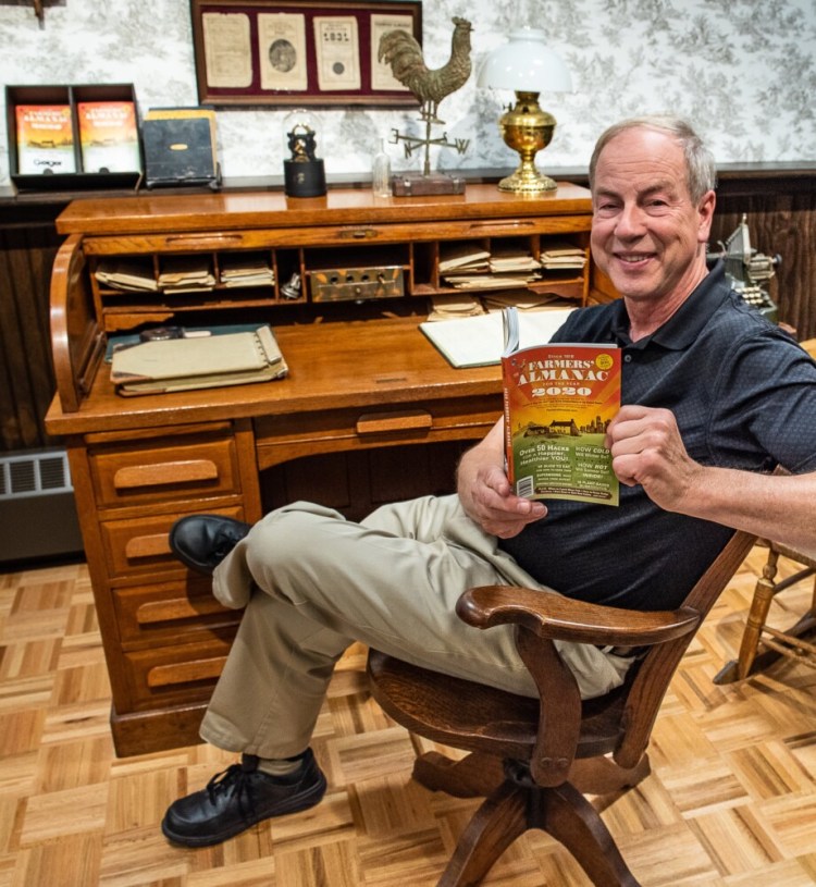Farmers' Almanac editor Peter Geiger holds the latest edition at Geiger in Lewiston on Wednesday afternoon. 