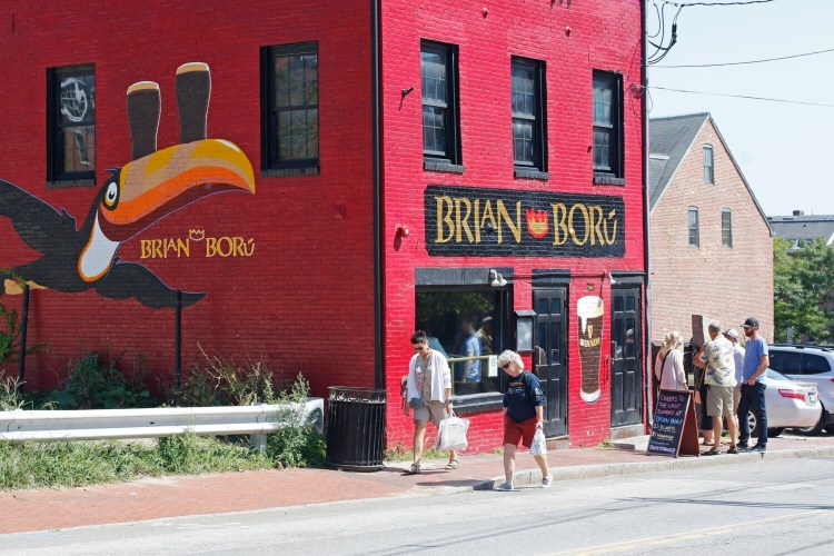 People gathered outside on the last day at Brian Boru in late August. The building was bought by a subsidiary of MEMIC, the Portland-based workers' compensation company, which also owns the adjacent building on Cotton Street. A spokesman for the nonprofit insurer said there are no imminent plans for the building. 