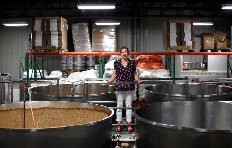 Robin Lapoint, co-owner of Geary Brewing Co., poses for a portrait in her brewery. The company has exported more than $57,000 worth of beer to the United Kingdom this year thanks to connections they made during a recent Maine Beer Box event. 