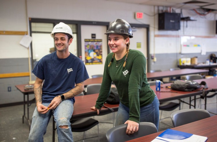 Ryan Morse, 26, left, and Miranda Shaubhut, 22, inside one of the classrooms at the Bath Iron Works training facility at Brunswick Landing. Both went through the BIW training facility. Now Morse is working as a shipfitter and Shaubhut as a welder.