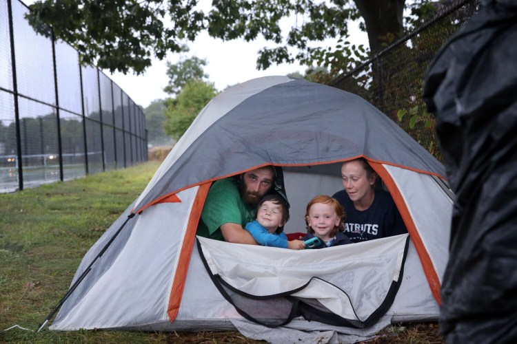PORTLAND, ME - AUGUST 28: David Pippin, Ashley Livingston and their children David, 5, left, and Harry, 3, are homeless and living in a tent after getting kicked out of a shelter for using their own money to buy school supplies. (Staff photo by Ben McCanna/Staff Photographer)