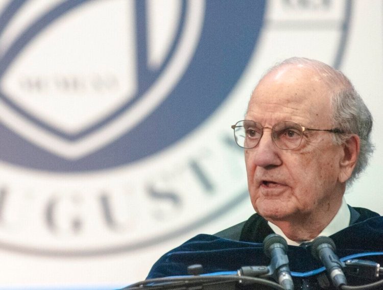 George Mitchell gives the commencement address during the University of Maine at Augusta graduation on May 12, 2018, at the Augusta Civic Center.