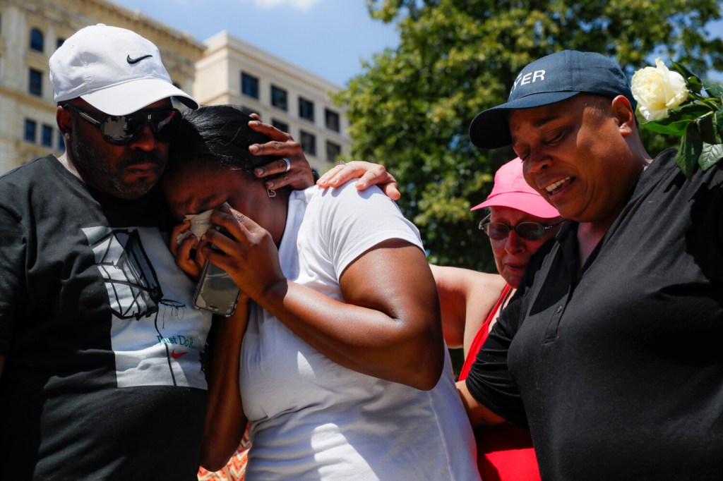 Mourners gather at a vigil after a mass shooting on Sunday in Dayton, Ohio. 

