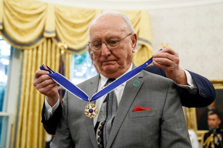 President Trump presents the Presidential Medal of Freedom to former NBA player and coach Bob Cousy of the Boston Celtics during a ceremony at the White House on Thursday.