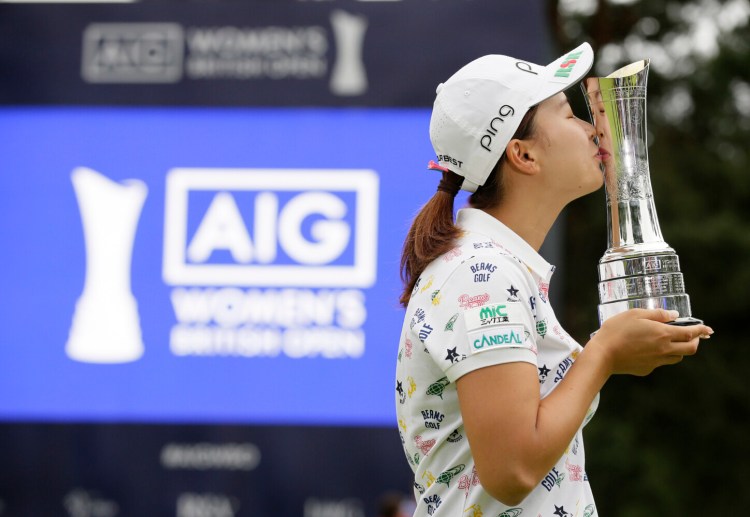 Hinako Shibuno kisses the trophy as she celebrates after winning the Women's British Open on Sunday at Woburn Gold Club near near Milton Keynes, England.