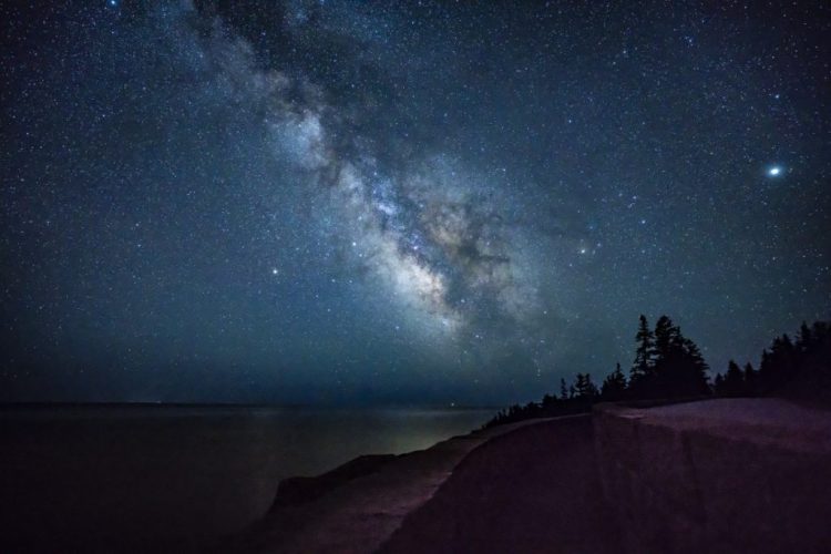 The Milky Way shines above the ocean off the coast of Acadia National Park in the early-morning hours of April 23, 2018. 