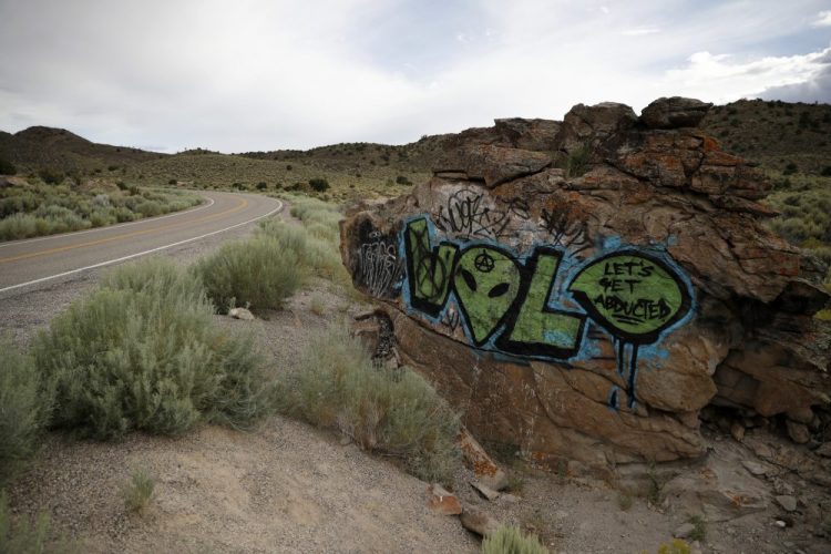 Alien-themed graffiti adorns a rock along the Extraterrestrial Highway, near Rachel, Nev., the closest town to Area 51. The U.S. Air Force has warned people against participating in an internet joke suggesting a large crowd of people "storm Area 51," the top-secret Cold War test site in the Nevada desert.