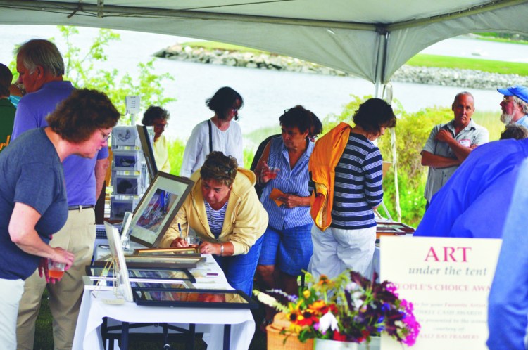 Community members peruse art on display and fill out ballots for the People’s Choice Award during a previous Lobster and More event, with the “Art Under the Tent,” held at the Lincoln Home in Newcastle.