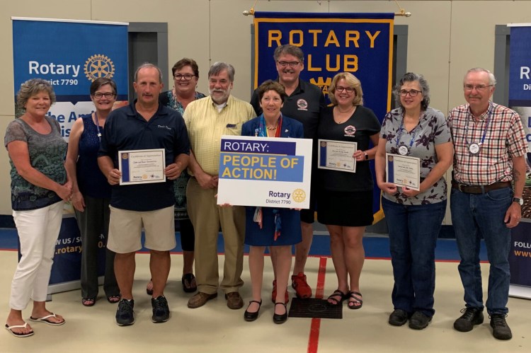 Gardiner Rotary recently honored three local business for outstanding community service. From left are Paula Tourtelotte, Mayor Patricia Hart, Dave Tourtelotte, Gardiner Rotary President Kathleen Cutler, Rep. Thom Harnett, District Governor Suzanne Uhl-Melanson, Joe Gould, Kristy Gould, Denise Emery and Leon Emery.