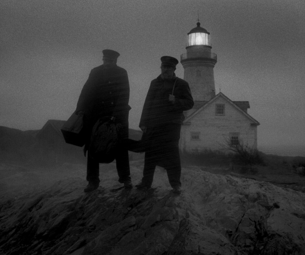 Robert Pattinson, left, and Willem Dafoe in a scene from "The Lighthouse."
