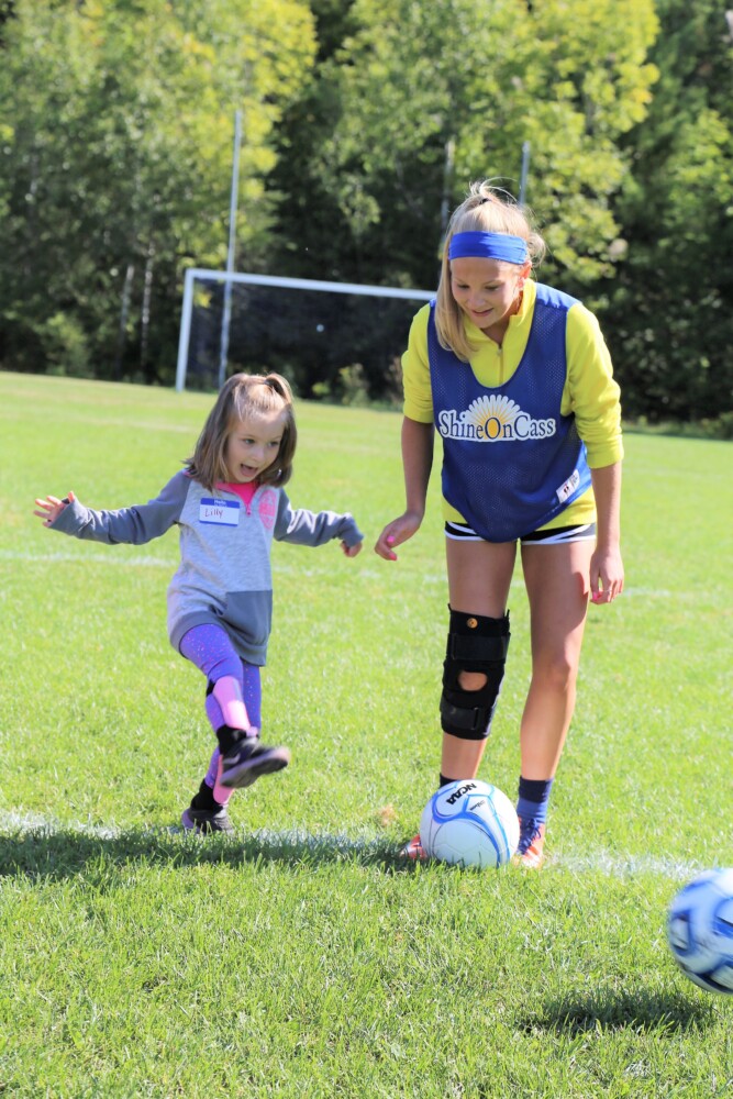 Messalonskee Girls Soccer player Lydia Bradfield, right, shares her foot skills with Lillyanne Dyer at last year’s “Shine On Saturday,” a girls youth mentoring day created by the Lady Eagles and the ShineOnCass Foundation to honor and remember Cassidy Charette. The event is free to all girls, pre-k to grade 5, will be held from 9 to 11 a.m. Saturday, Sept. 7,  at Messalonskee High School Turf Field in Oakland. For more information, visit shineoncass.org.