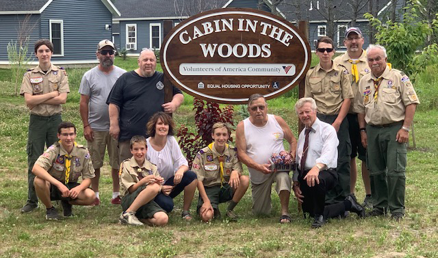 Remy Pettengill's Cabin in the Woods project was made possible by those who helped with the distribution. Front from left are Aiden Pettengill,  Bryson Pettengill, Danielle Pettengill, Remy Pettengill; Kevin, a homeless vet who help identify vets by cabin; and Dan Hill. Back from left are Michael Boostedt, Kevin Boostedt, Darren Corson, Cole Corson, Lee Pettengill and Ron Emery.