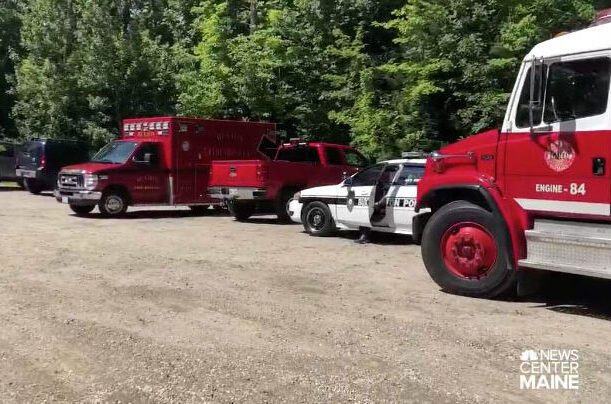 First responders from multiple departments search the Saco River in Buxton on Friday for a teenager who went into the river and never resurfaced.