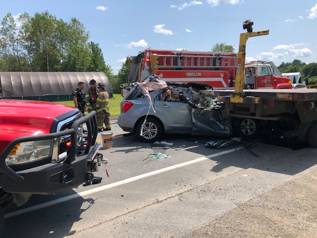 A passenger car was reported to have collided with the rear end of a flatbed trailer on Augusta Road in Winslow at about 1 p.m. Friday. The Winslow Fire Department was one of the first responders at the scene.