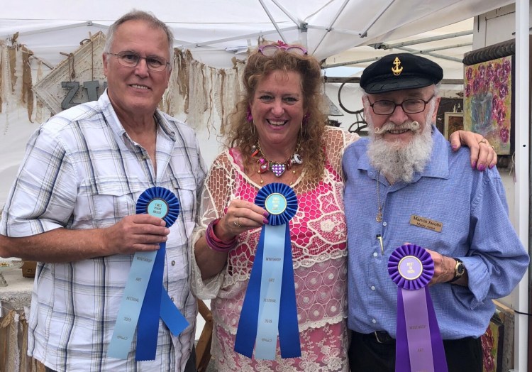 Winthrop Sidewalk Festival winners from left are painter Paul Boucher, of Lewiston, who won Best Fine Artist; Tinalyn Caisse ,of Winthrop, who won Best Fine Crafts; and painter Marvin Jacobs, of Belmont, who won Best in Show. 