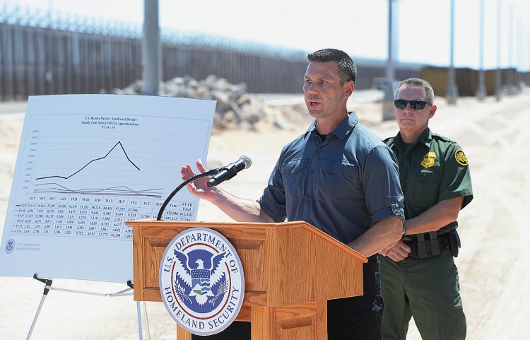 Acting U.S. Secretary of Homeland Security Kevin McAleenan, left, and U.S. Border Patrol, Chief Patrol Agent Anthony Porvaznik on the U.S.-Mexico border, near the San Luis, Ariz. on Thursday.