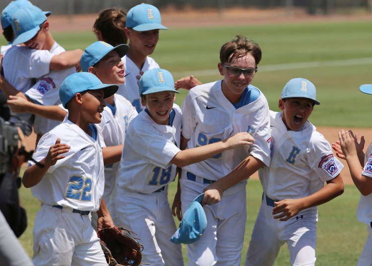 Louisiana Conner Perrot (99), center, celebrates with Will Andrade (18) along with Stan Wiltz (22), left, and Peyton Spadoni (1), right, following their 6-2 win over Texas West at the Southwestern Little League baseball regional championship game on Aug. 7.
