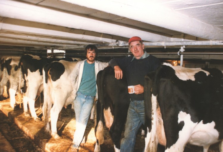 Richard Corey, left, stands with his father Leigh at the start of his farming career.