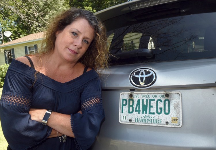 Wendy Auger will be allowed to keep her vanity plate even though N.H. rules say 'excretory acts' aren't permitted on license plates.