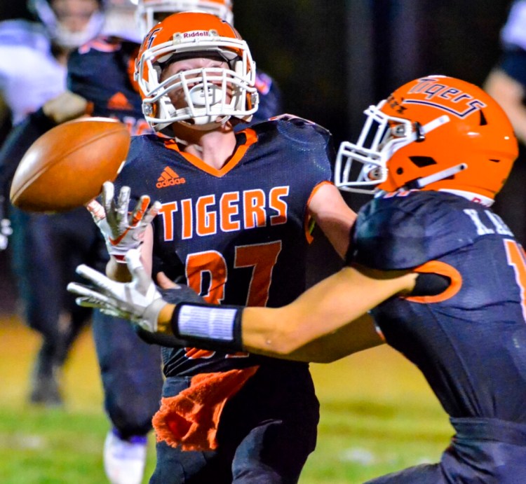 Gardiner defensive backs Gage Chase, left, and Kyle Adams juggle the ball during a game against Skowhegan earlier this season in Gardiner. 