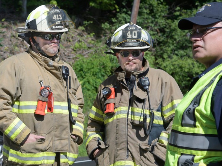 Manchester Fire Chief Frank Wozniak, center, at is seen at a vehicle crash on Aug. 6, 2019, on Route 201 in Hallowell.