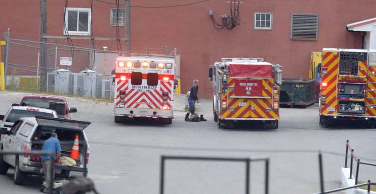 Rescue workers respond Thursday to Tex Tech Industries in Monmouth to help a worker who reportedly was injured inside the plant.