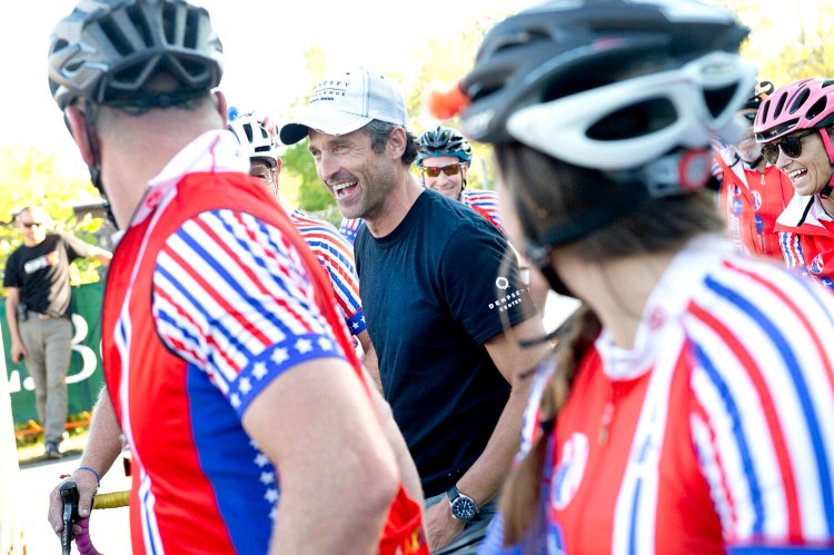 Patrick Dempsey greets the Challenge to Conquer Cancer riders at Simard-Payne Memorial Park in Lewiston in September. The team rides from South Carolina to participate in the Dempsey Challenge each year. Dempsey has been named honorary captain of the U.S. Olympic cycling team.