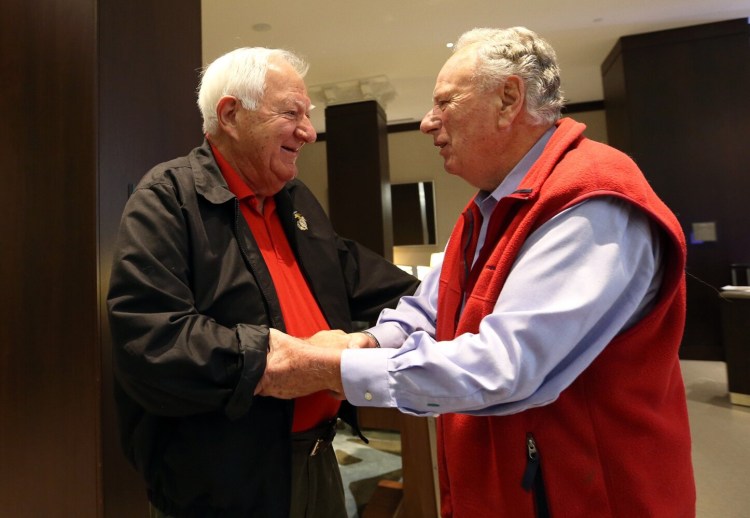 PORTLAND, ME - SEPTEMBER 28: Vietnam veterans, Orson Swindle, left, who was shot down during a bombing mission, shakes hands with Dick Manning, who was a forward spotter on the same mission, as they meet for the first time Saturday at the Westin Portland Harborview. (Staff photo by Ben McCanna/Staff Photographer)