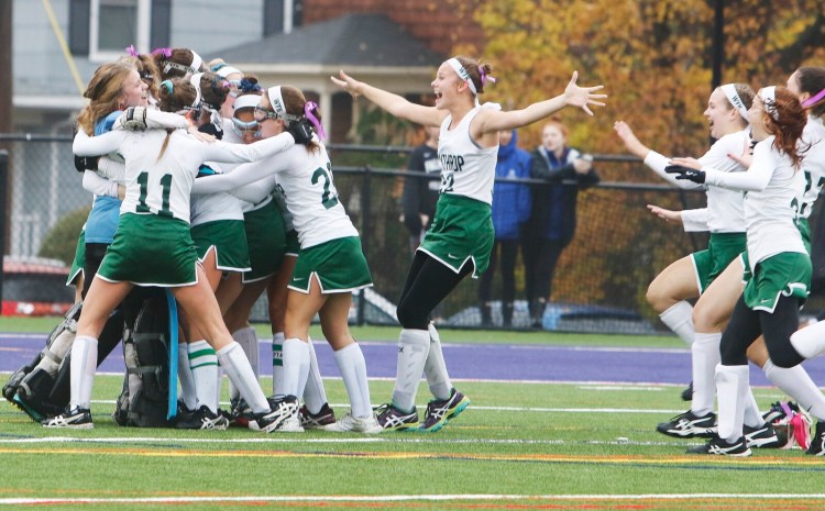 The Winthrop field hockey team celebrates its 3-1 victory over Spruce Mountain in the Class state final last year at Deering High School in Portland.