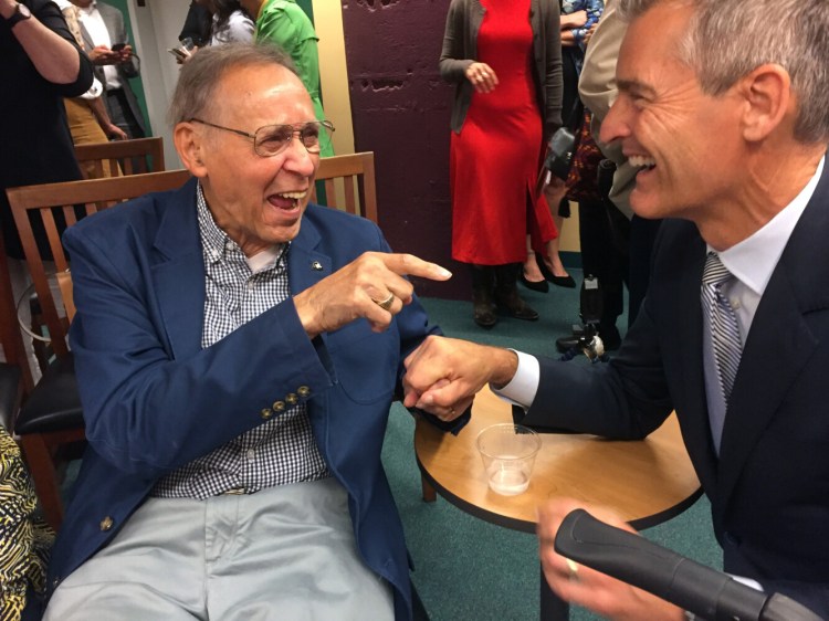 Gerald Talbot, Maine’s first African-American legislator and a prominent black historian, shares a light moment Tuesday with Glenn Cummings, president of the University of Southern Maine, which has established a teaching fellowship in Talbot’s honor that will be dedicated to race in Maine. 