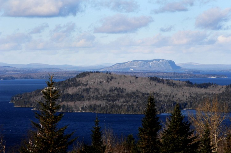 Mount Kineo rises behind Moosehead Lake. Weyerhaeuser  owns hundreds of thousands of acres in the Moosehead Lake region.