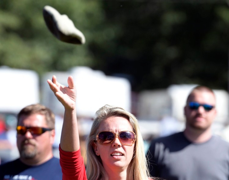 Natasha Littlefield tosses a bag during the cornhole tournament at the Windsor Fair on Sunday.