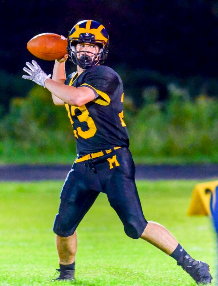 Maranacook quarterback Garit Laliberte drops back to pass during a game against Boothbay earlier this season at the Ricky Gibson Field of Dreams in Readfield. 