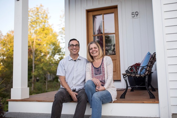 Rob and Wendy Pereira sit outside their home in Portland. The couple moved to Portland from the San Francisco Bay Area nearly two years ago. The Greater-Portland area is different than most U.S. metro areas in that more than half of the buyer interest in its available homes is coming from outside of the state. 