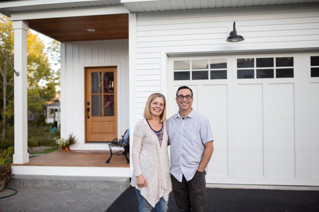 PORTLAND, ME - SEPTEMBER 18: Rob and Wendy Pereira outside their home in Portland on Wednesday, Sept. 18, 2019. The couple moved to Portland from the San Francisco Bay Area nearly two years ago. The Greater-Portland area is different than most U.S. metro areas in that more than half of the buyer interest in its available homes is coming from outside of the state. (Staff Photo by Brianna Soukup/Staff Photographer)