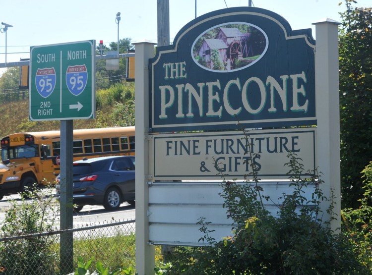 The Waterville Planning Board on Monday will consider rezoning part of 475 Kennedy Memorial Drive to allow an adult-use-marijuana store to open there once state rule regarding adult-use marijuana are issued. The former Pine Cone furniture shop at that address is seen near the Interstate 95 interchange on Thursday.