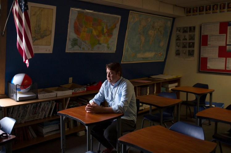 History teacher Chad Denis in his classroom at Old Orchard Beach High School on Tuesday. Denis' first day of student teaching was 18 years ago, Sept. 11, 2001.