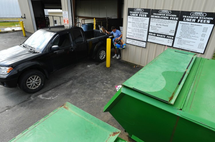 Trash is dropped off at the hopper at the China Transfer Station on Wednesday. 