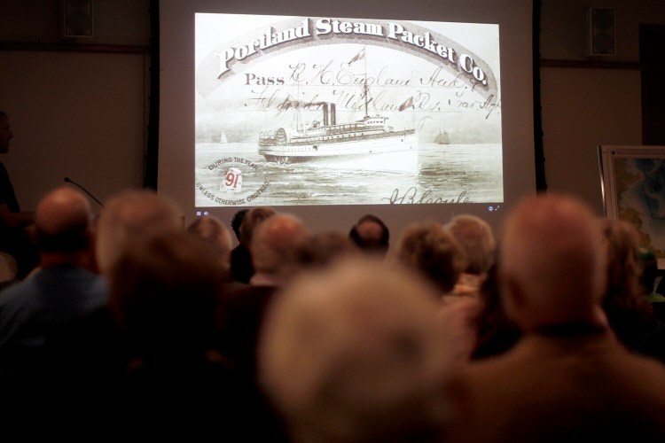 Descendants of people who died when the SS Portland sank are in the audience at the Maine Historical Society on Wednesday to watch researchers explore the wreck off the coast of Massachusetts using a remotely operated submersible.