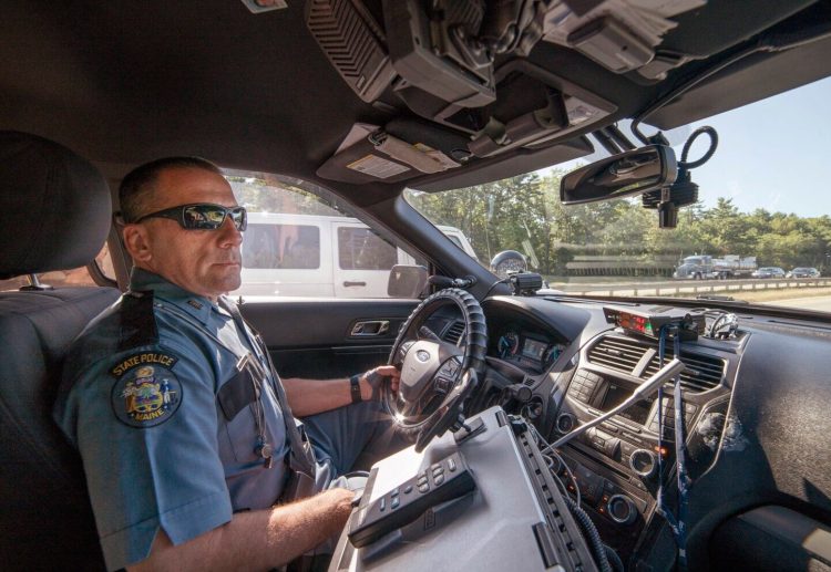 Maine State Police Trooper Anthony Keim patrolled the Maine Turnpike in Scarborough on the first day of Maine's hands-free driving law looking for drivers holding cellphones.