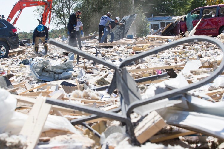 The blast leveled the building that housed LEAP - a nonprofit that serves people with cognitive and intellectual disabilities- damaged or destroyed more than a dozen homes and blanketed the surrounding area with shredded paper, insulation and lumber.