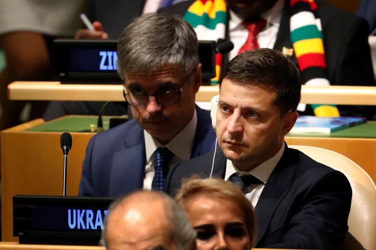 Ukrainian President Volodymyr Zelensky listens to speakers at the 74th session of the United Nations General Assembly at U.N. headquarters on Tuesday. He told reporters: "I think you read everything. I think you read [the] text. I'm sorry, but I don't want to be involved to democratic, open elections, elections of U.S.A. ... Nobody pushed me."
