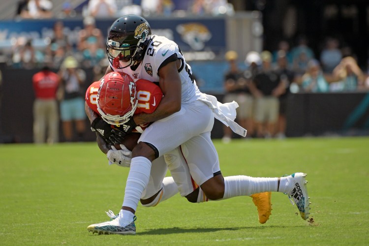Kansas City wide receiver Tyreek Hill is tackled by Jacksonville cornerback Jalen Ramsey on Sunday in Jacksonville, Florida. Hill was taken to the hospital after leavign the game with a shoulder injury.
