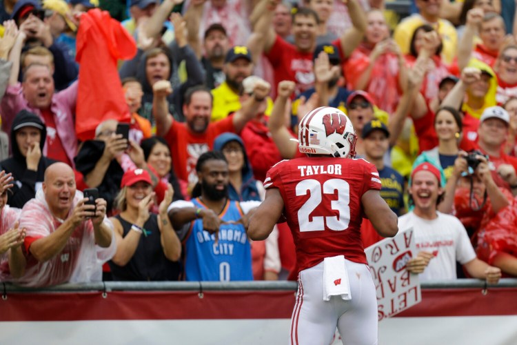Jonathan Taylor rushed for 203 yards and two touchdowns to lead Wisconsin to a 35-14 win over Michigan on Saturday in Madison, Wisconsin.