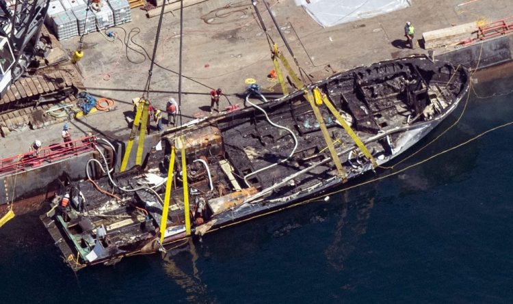 The burned hull of the dive boat Conception is brought to the surface by a salvage team off Santa Cruz Island, Calif. 
