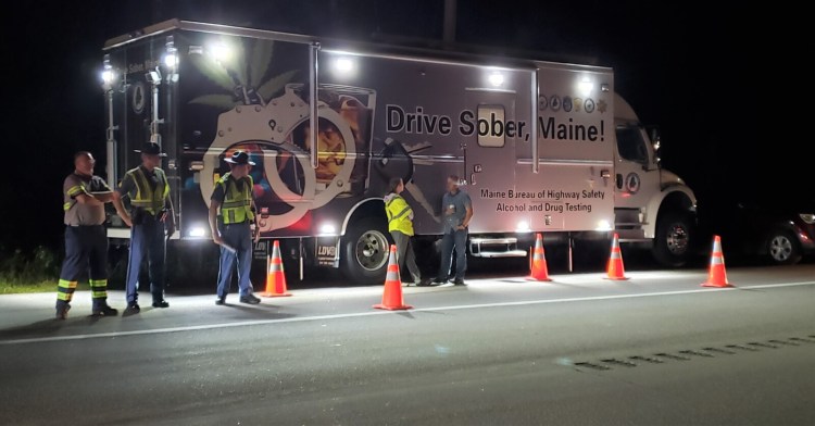 Officers work at a sobriety checkpoint last week on Route 202 in Lebanon. 
