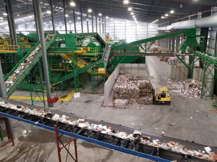 The Municipal Review Committee says it has found a partner that could provide the financial backing to help reopen this recycling and waste-to-energy plant in Hampden. Above, the then-Coastal Resources of Maine plant is shown in operation in 2019. The plant later closed for financial reasons.